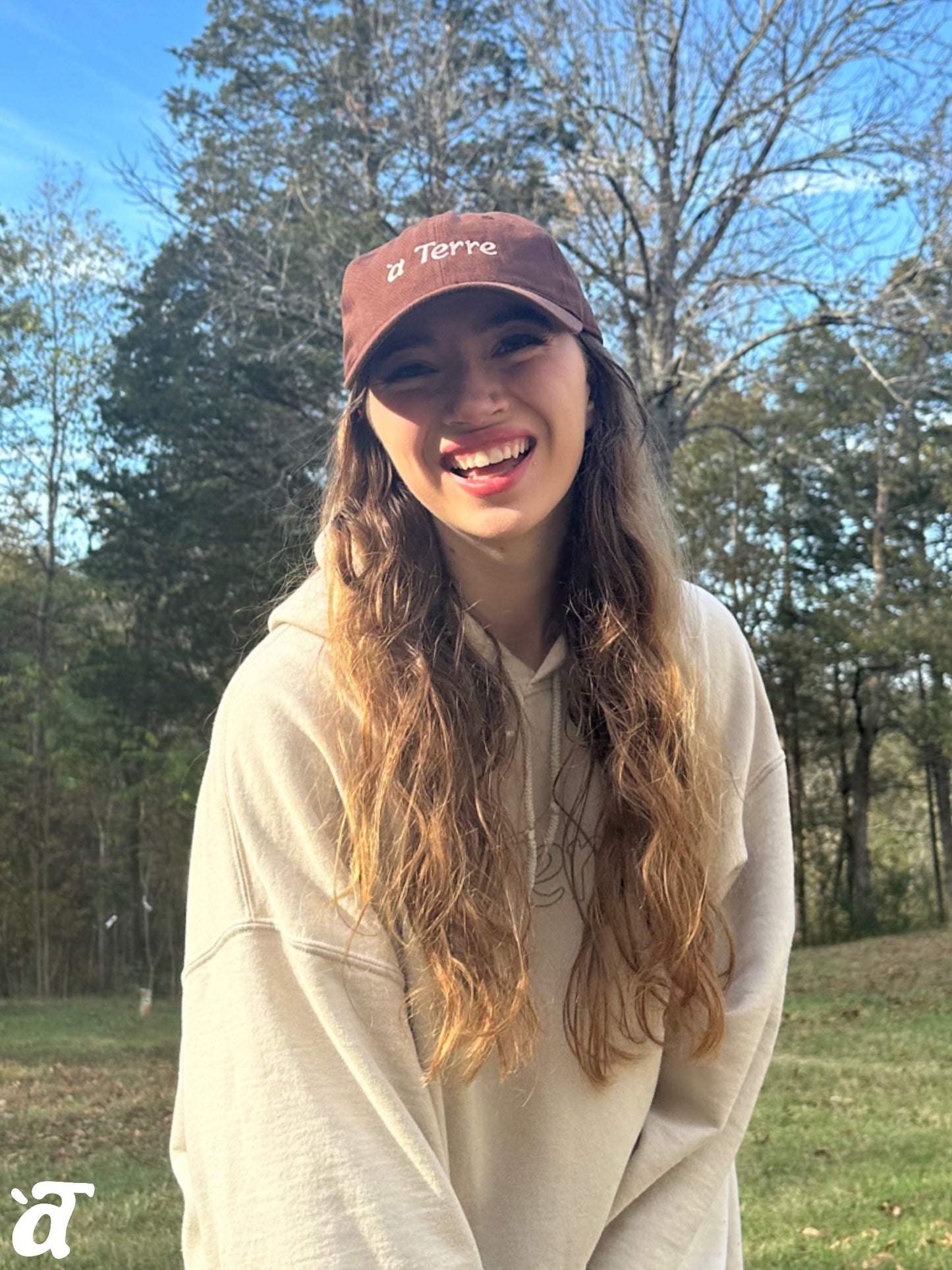 a Terre Merch Baseball Hat - Brown/Pink