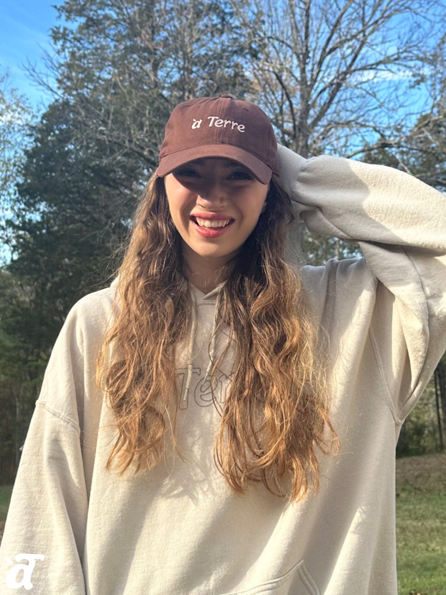 a Terre Merch Baseball Hat - Brown/Pink